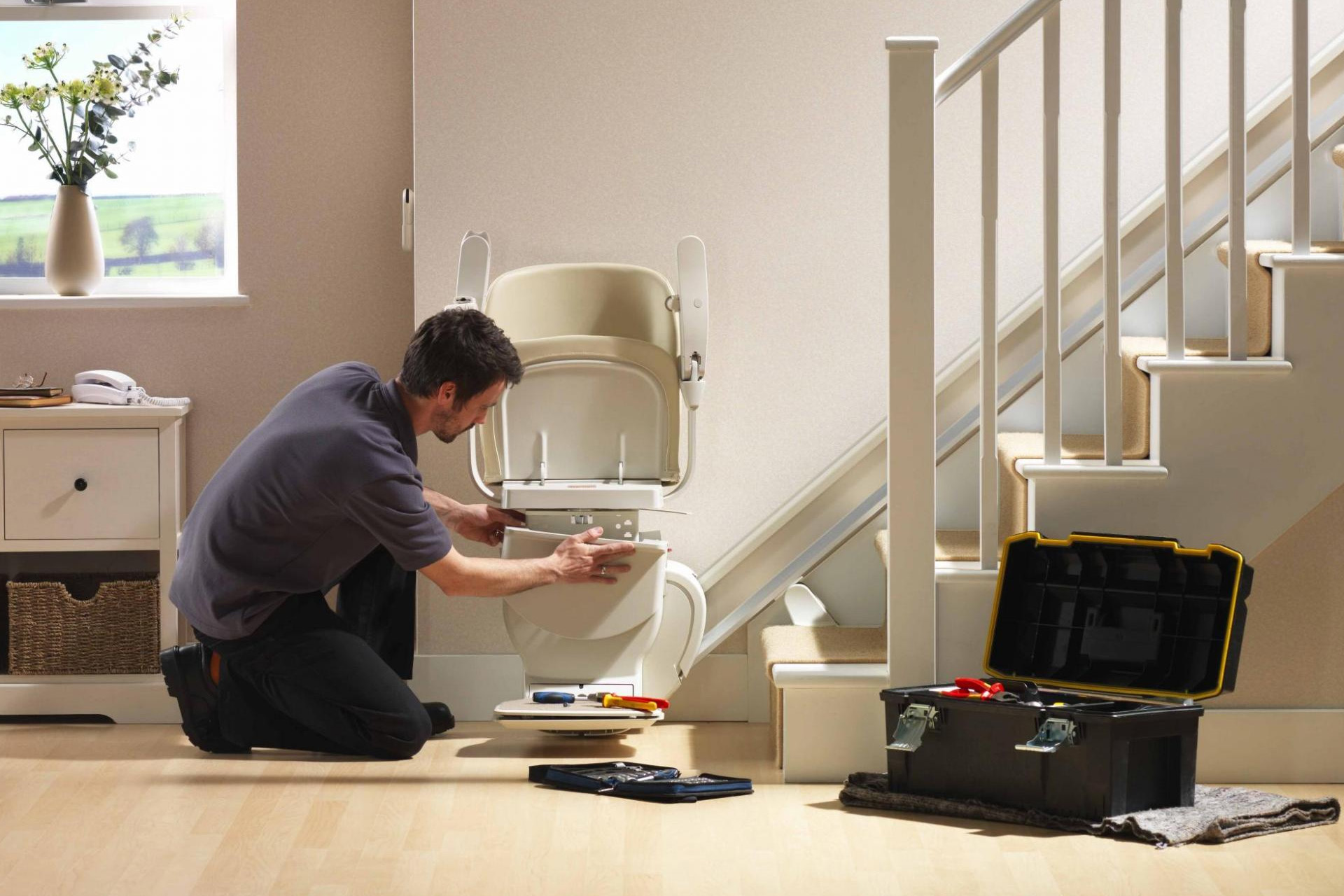 Engineer removing a stairlift from a staircase